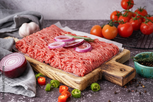 Wooden board of fresh mince...