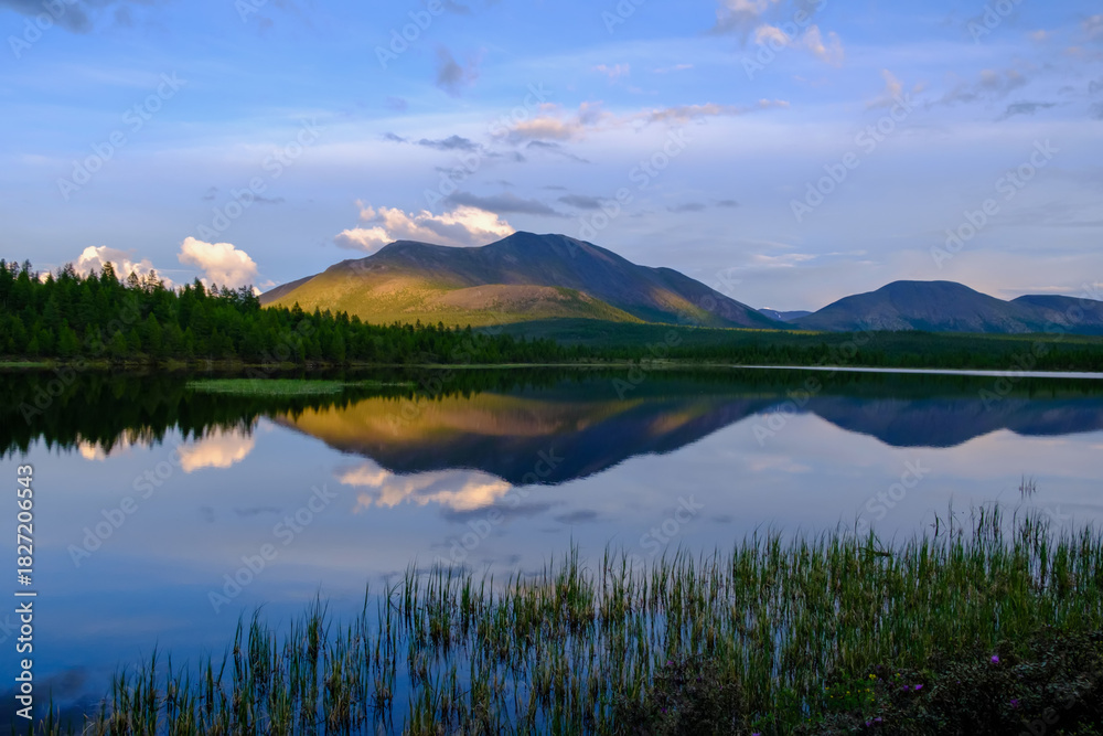 Obraz premium Sunset panorama of small lake with mountain reflection in Siberia, Buryatia, Russia
