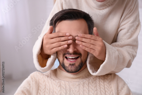 Young woman covering her hu...