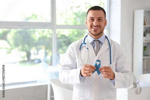 Male urologist with blue ri...