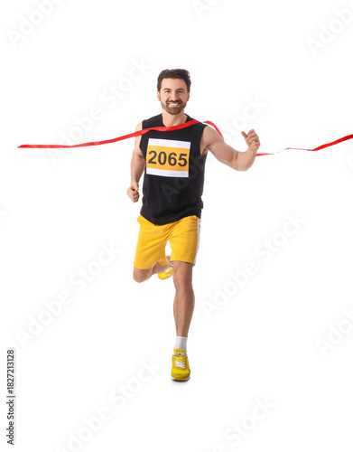 Sporty young man crossing m...