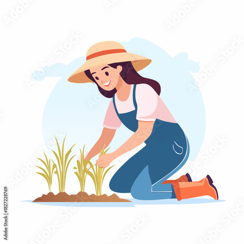 Female gardener tending young crops in garden.