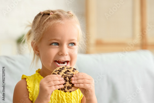 Cute little girl eating tas...