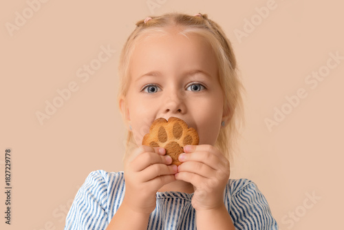 Cute little girl eating tas...