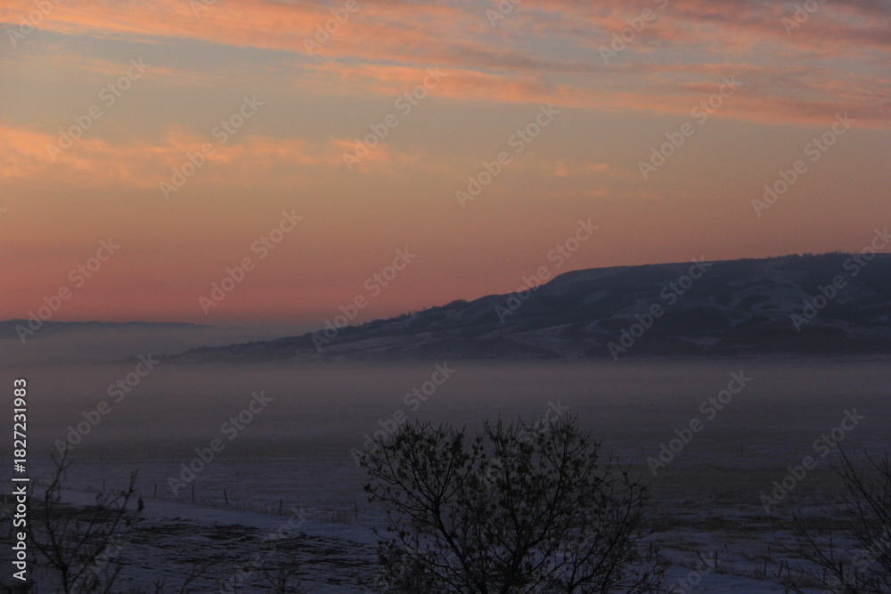 Fototapeta premium Crisp and Cold Sunrise in the Fog Covered Valley.