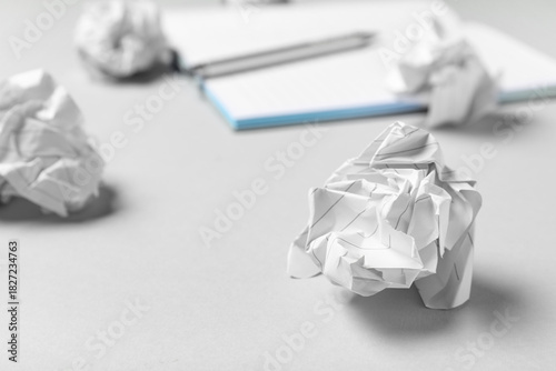 Notebook and crumpled piece...