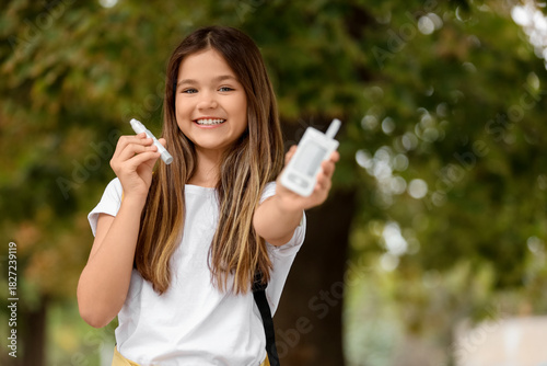 Teenage diabetic girl with ...