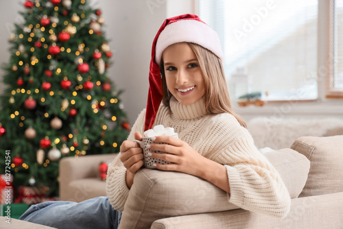 Teenage girl with cup of ho...