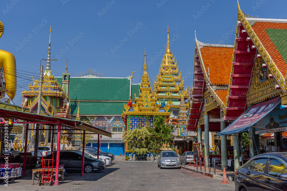 Naklejka premium 27 November 2025 View of Temple Wat Paknam Phase Charoen with Large Golden statue of Buddha and sleeping Buddha on Klhong Dan a Canal river system in BKK Bangkok Thailand