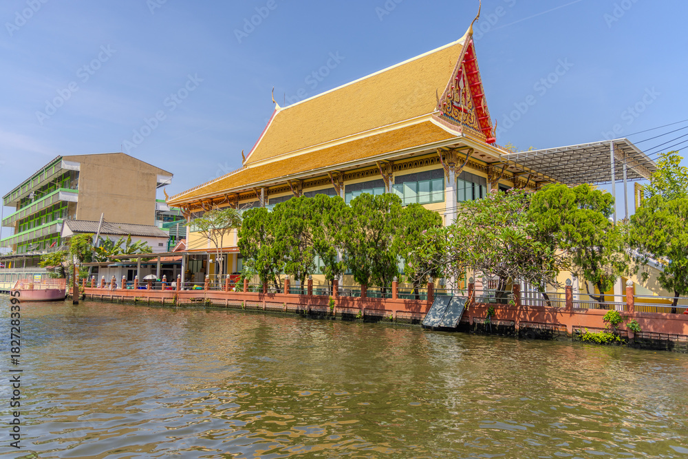 Fototapeta premium 27 November 2025 View of Temple Wat Paknam Phase Charoen with Large Golden statue of Buddha and sleeping Buddha on Klhong Dan a Canal river system in BKK Bangkok Thailand