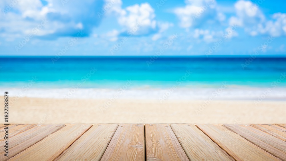 Fototapeta premium A wooden deck extends towards a serene beach scene, featuring soft sand and calm turquoise waves under a bright sky filled with fluffy clouds, creating a peaceful coastal atmosphere