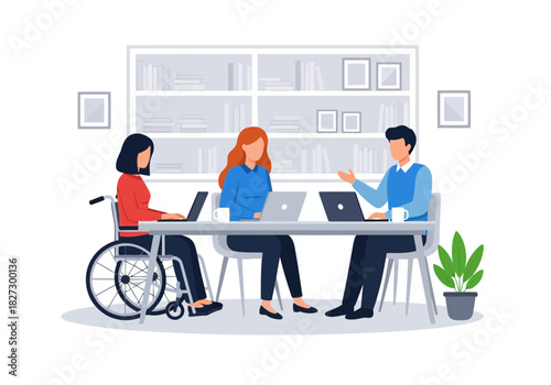 Diverse team meeting around table with laptop, including a woman in a wheelchair