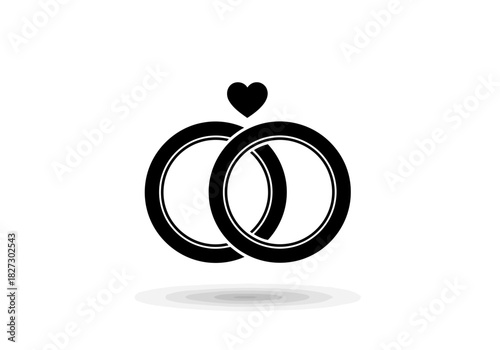 Black silhouette icon of two interlocking wedding rings with a small heart above them