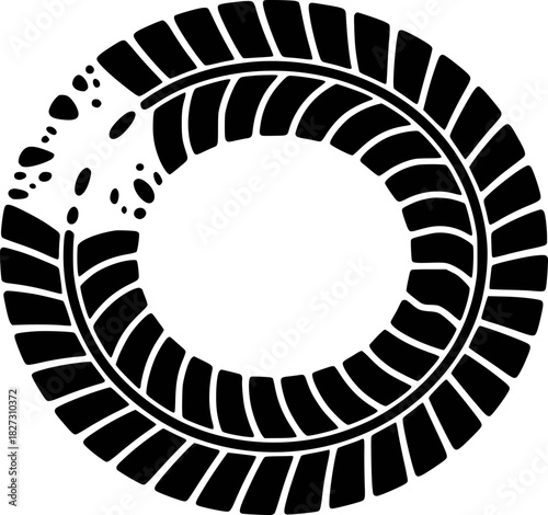 Black tire tread pattern with a section of scattered dots and debris