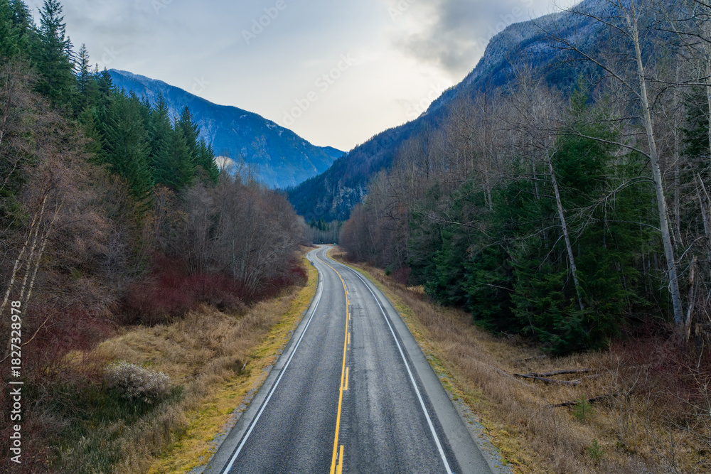 Fototapeta premium Winding Mountain Road Through Forested Valley in BC, Canada Landscape Scene