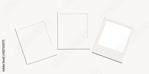 Three blank instant photo frames arranged on a light background