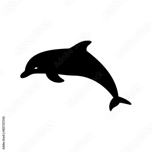 A solitary dolphin gracefully arches, captured in a stark black silhouette against white