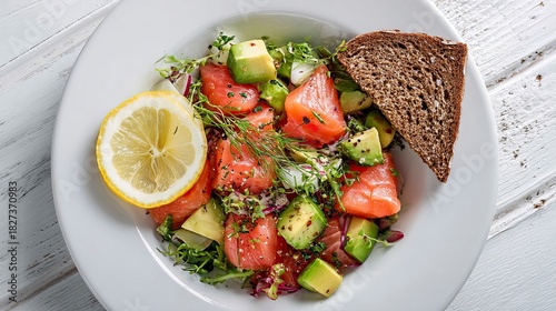 Indulge in a vibrant salmon and avocado salad with lemon and dark bread, offering a healthy and delicious culinary experience for your audience