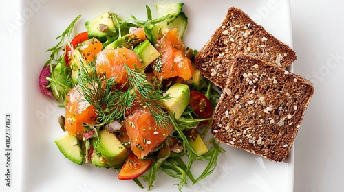 Vibrant salmon salad with creamy avocado, fresh dill, and toasted whole grain bread for a delicious and healthy lunch, perfect for wellness enthusiasts