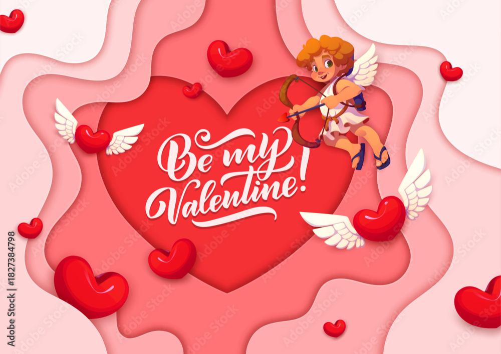 Fototapeta premium Be my valentine paper cut greeting card with cherubs. Vector romantic banner featuring red 3d heart frame with elegant script. Cheerful cupid with a bow and arrow floats surrounded by soft pink layers