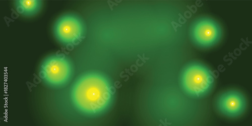 Abstract dark green background with glowing yellow bokeh lights resembling fireflies in a magical forest at night.