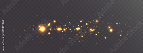 Golden glowing sparkles and scattered light particles forming a bright magical dust trail on a transparent dark background.
