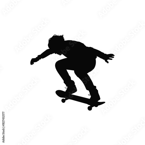 Silhouette of a skateboarder performing a trick against a white background