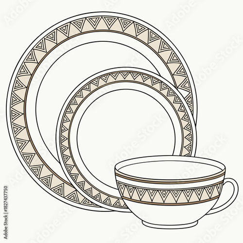 Elegant white dinnerware set featuring a geometric tribal pattern on the rim of plates and a teacup