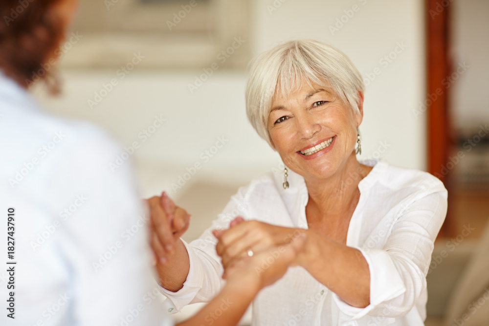 Obraz premium Portrait, old woman and holding hands with daughter, house and bonding in lounge, together and love. Retirement, pensioner and family with affection in living room, happiness and people in USA
