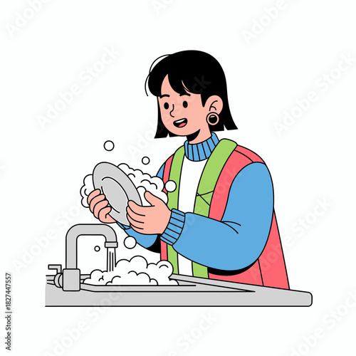 Happy young woman washing dishes in a kitchen sink with running water and soap suds