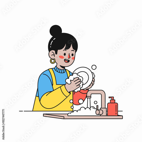 A cheerful young woman in an apron happily washing dishes in the kitchen sink with soap suds