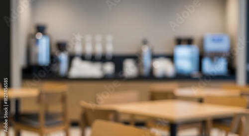 Workplace Break Area Blur – Defocused scene of tables, chairs, and coffee station