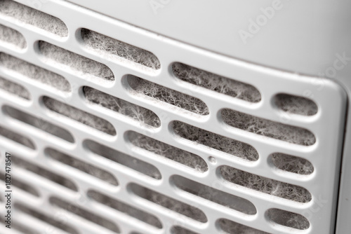 Dust clogged air purifier filter. Dirty used HVAC element. Home appliance component