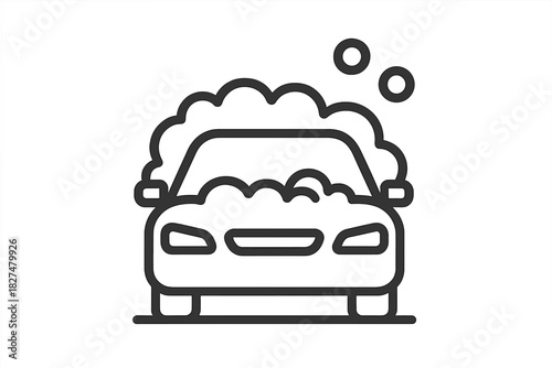 Automobile covered in soap suds and cleaning foam bubbles during wash service