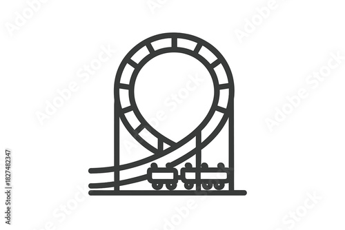 Amusement park roller coaster track with a large vertical loop and moving cars