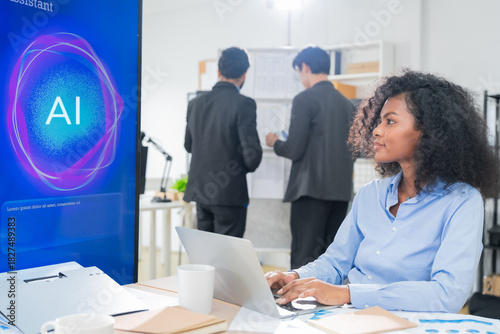 Diverse business professionals, both male and female, collaborate in a bright modern office, using an AI powered virtual assistant to brainstorm innovative ideas, analyze big data insights	