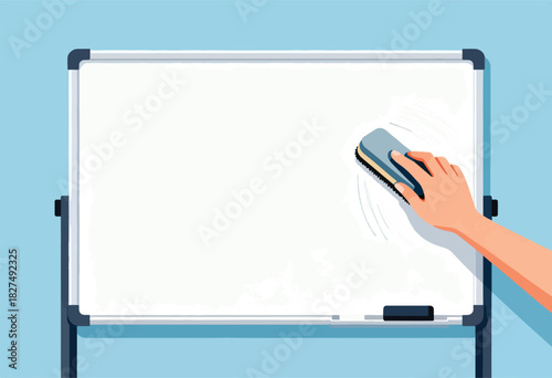 A hand uses a whiteboard eraser to clean a whiteboard. Whiteboard is blank on a blue background