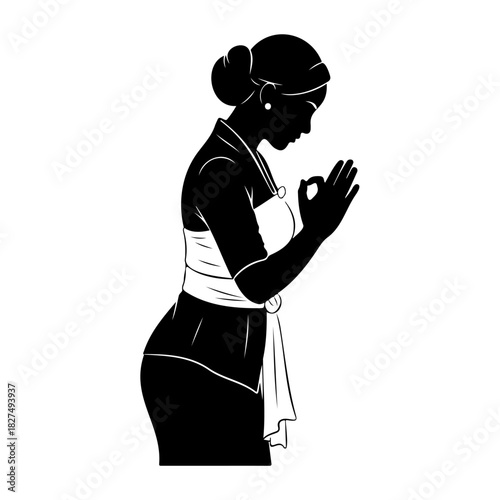 Silhouette of a woman in traditional dress making a hand gesture ok