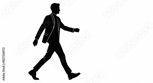 Silhouette of a man in a suit walking confidently.