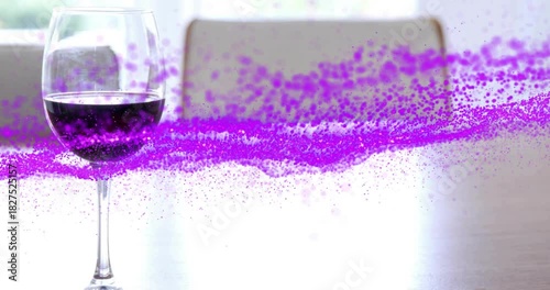 Violet ribbon emerging edge starting left across table passing through glass showing refraction