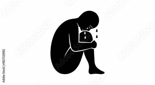 Silhouette of a person crying in a fetal position.
