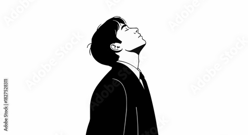 Man in Suit Gazing Upward with Contemplative Expression.