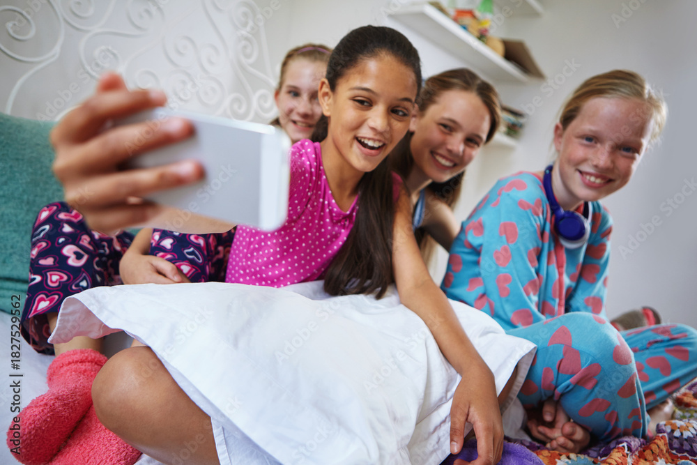 Obraz premium Selfie, smile and teenagers at sleepover in home for memory, fun and social media post together. Bonding, happy and group of girl friends with photography picture for hangout in bedroom on weekend.