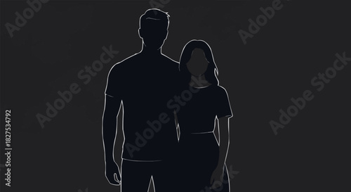 Silhouette of a couple standing together against a dark background.