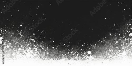 Black ink splash on a white background with a dark, magic galaxy of stars and snowflakes in winter night sky motion
