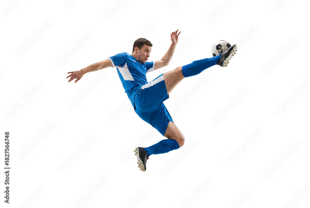 Fototapeta premium Male soccer player performing flying kick in midair on isolated black background, athletic action and competitive sports concept for training, fitness promotion and team spirit themes