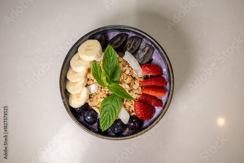 Konstfotografi Healthy Delight: A vibrant bowl bursting with a rainbow of fresh fruits and granola, a nutritious and visually appealing breakfast or snack option
