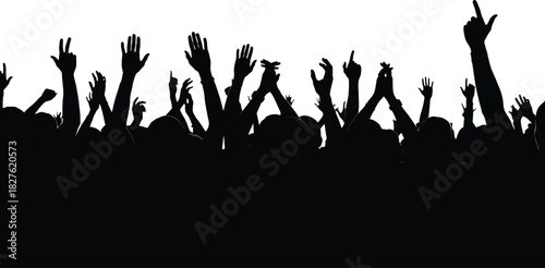 Silhouette of crowd with raised hands at concert or event