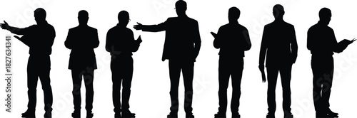 Silhouetted business professionals working together in a team environment