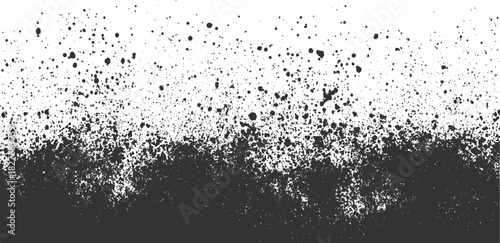 Black ink splatter texture on white background with dense bottom and scattered top abstract blotch